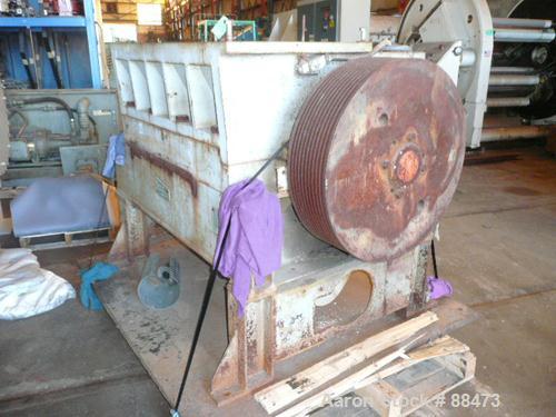 Used Polymer Machinery Granulator, Model 2040. 3-knife open rotor. 20" x 40" feed throat with hopper. Requires an approximate 150 hp motor. Mounted on legs with a base.
