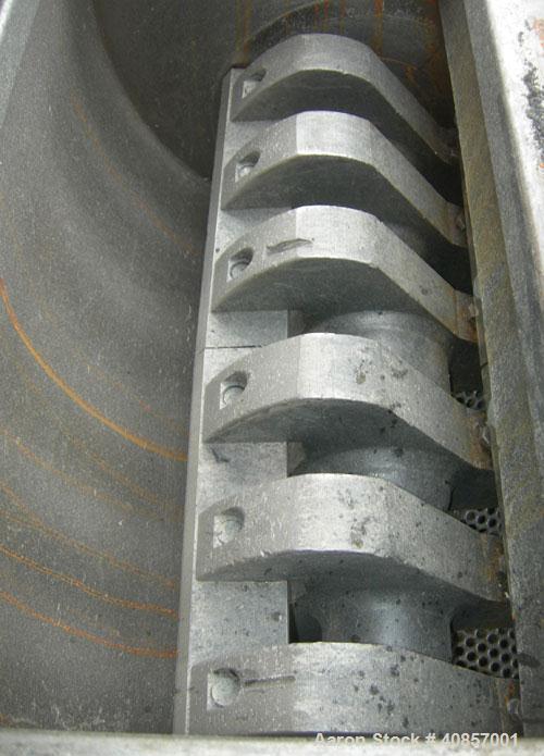 Used Rapid Granulator, Model 1224K. Approximately 12" diameter x 24" wide, 3 rows of 2 bolt on slanted blade open rotors. Tilt back pelican style feed hopper, set up for blower discharge with bottom ...