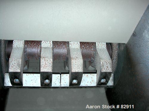 USED: Rapid granulator, model 1824K. Approx 18" diameter x 24" wide open rotor with 3 rows of 2 bolt on blades. Tilt back pelican style feed hopper, set up for blower discharge. Driven by an approx 2...