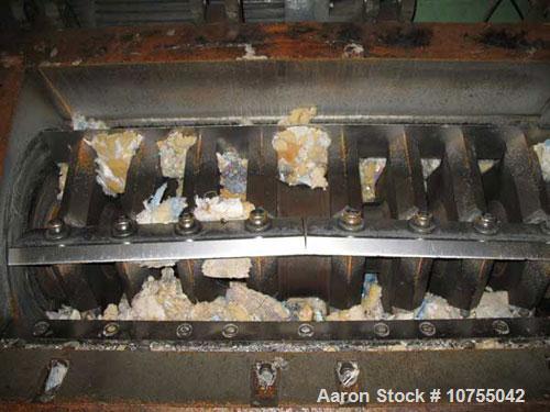Used Rapid Model 2442H Granulator. 24" x 42" cutting chamber dimension. Conveyor infeed with pneumatic tilt back assist. Unit equipped with 5 knife open rotor. Dual flywheel, D2 bed knives with optio...