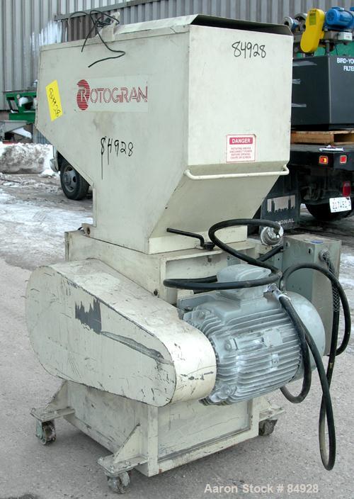 USED: Rotogran grinder, model PH1418. Approx 14" diameter x 18" wide 3 bolt-on blade open rotor, (2) bed knives. Tilt back pelican style feed hopper, bottom discharge, no drawer. Approx 1/2" diameter...
