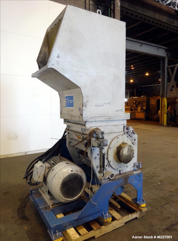 Used Tria Granulator, Carbon Steel. Approximate 20" x 26" feed throat with a bolt on feed hopper. Approximate (4) rows bolt on blades, open rotor, set up for bottom blower discharge with a 2.2kw blow...