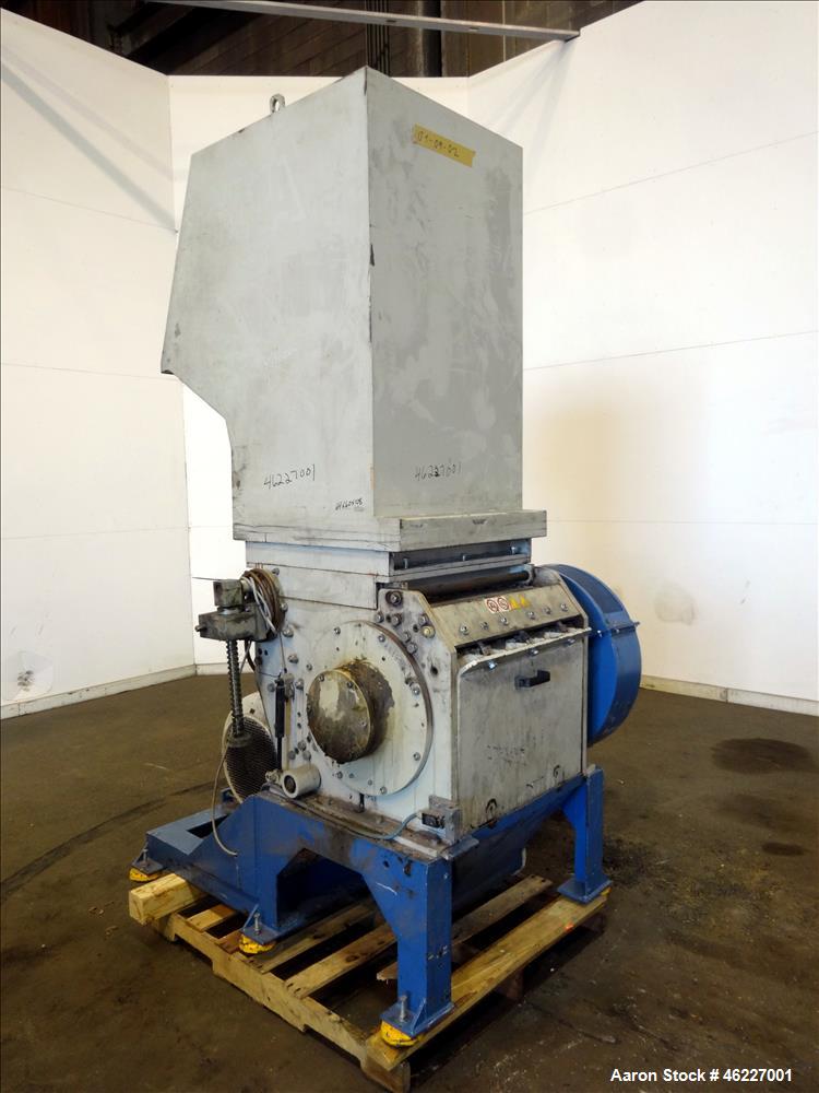 Used Tria Granulator, Carbon Steel. Approximate 20" x 26" feed throat with a bolt on feed hopper. Approximate (4) rows bolt on blades, open rotor, set up for bottom blower discharge with a 2.2kw blow...