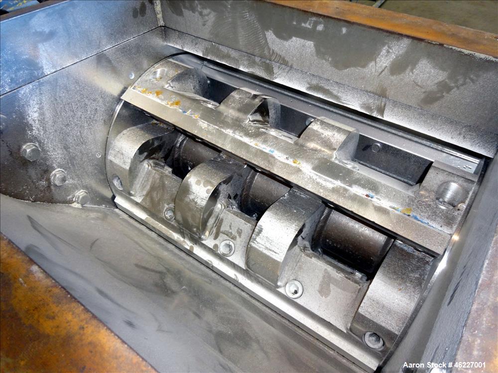 Used Tria Granulator, Carbon Steel. Approximate 20" x 26" feed throat with a bolt on feed hopper. Approximate (4) rows bolt on blades, open rotor, set up for bottom blower discharge with a 2.2kw blow...