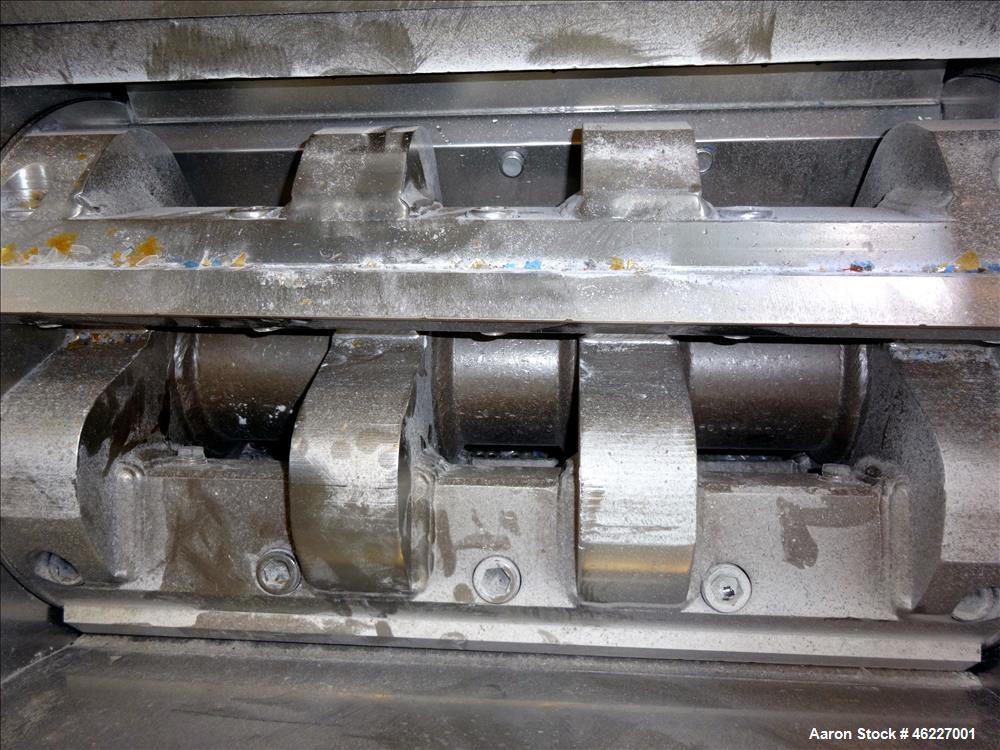 Used Tria Granulator, Carbon Steel. Approximate 20" x 26" feed throat with a bolt on feed hopper. Approximate (4) rows bolt on blades, open rotor, set up for bottom blower discharge with a 2.2kw blow...