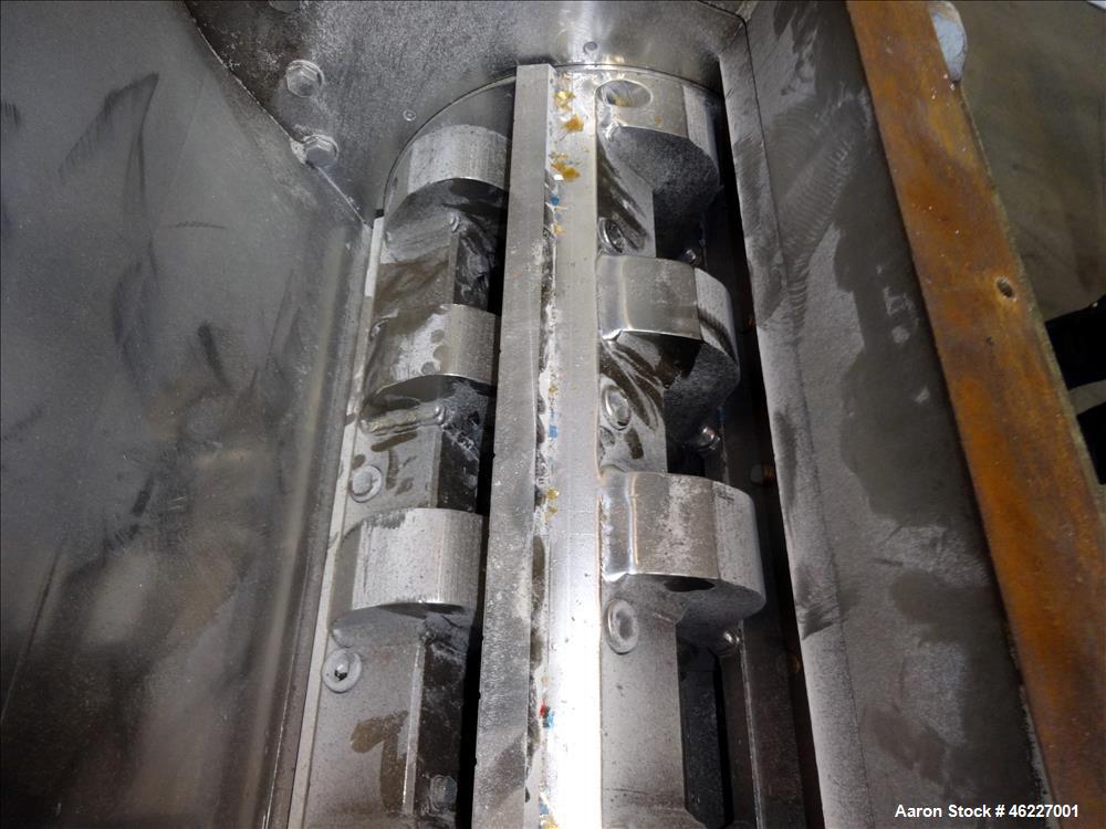 Used Tria Granulator, Carbon Steel. Approximate 20" x 26" feed throat with a bolt on feed hopper. Approximate (4) rows bolt on blades, open rotor, set up for bottom blower discharge with a 2.2kw blow...
