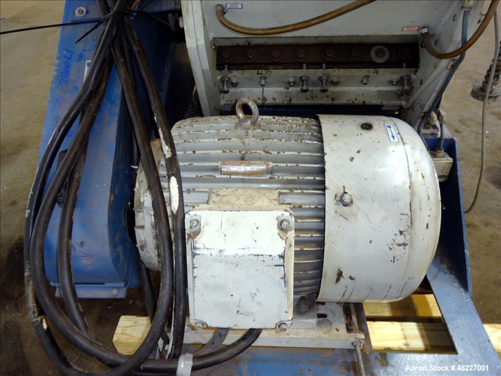 Used Tria Granulator, Carbon Steel. Approximate 20" x 26" feed throat with a bolt on feed hopper. Approximate (4) rows bolt on blades, open rotor, set up for bottom blower discharge with a 2.2kw blow...