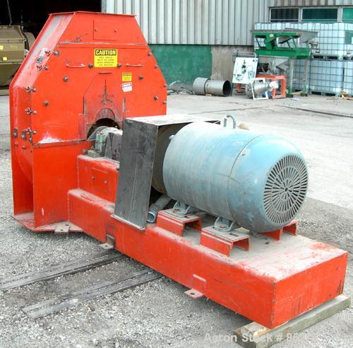 Used United Farm Tools Inc Hammermill, Model MM6215PL80, Carbon Steel. Approximate 40" diameter disc rotor with bolt-on blades. 4", 6" side bottom feed openings, 15" x 18" top discharge with approxim...