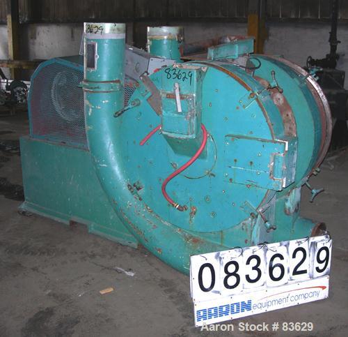 USED: Wedco dual disc pulverizer system, carbon steel. (2) 28" diameter discs, approx 3" deep chambers. Hinged side door feed, set up for bottom blower discharge. Both driven by a 100 hp, 3/60/208-23...