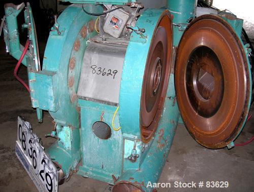 USED: Wedco dual disc pulverizer system, carbon steel. (2) 28" diameter discs, approx 3" deep chambers. Hinged side door feed, set up for bottom blower discharge. Both driven by a 100 hp, 3/60/208-23...