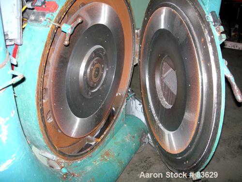 USED: Wedco dual disc pulverizer system, carbon steel. (2) 28" diameter discs, approx 3" deep chambers. Hinged side door feed, set up for bottom blower discharge. Both driven by a 100 hp, 3/60/208-23...