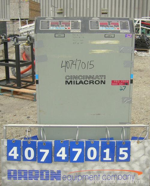 Used Cincinnati Milacron Hot Oil Temperature Control Unit,model CD0TC-100, 12 kw, 2 zones. Temperature range 100-500 deg F. 3/60/460 volt, 40 amp. Mounted on casters.