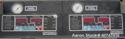 Used Cincinnati Milacron Hot Oil Temperature Control Unit,model CD0TC-100, 12 kw, 2 zones. Temperature range 100-500 deg F. 3/60/460 volt, 40 amp. Mounted on casters.