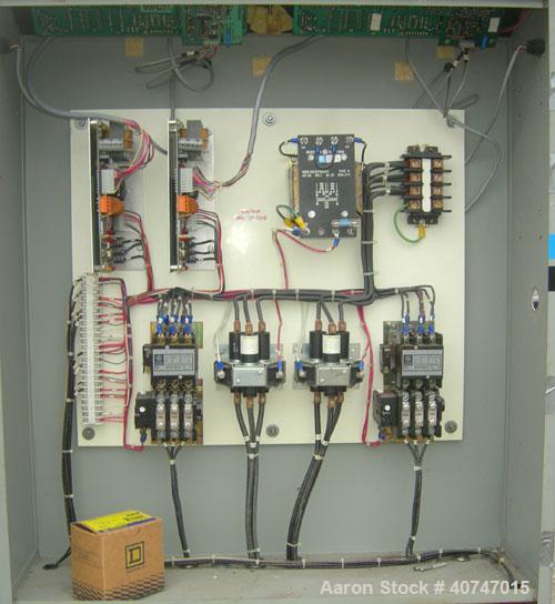 Used Cincinnati Milacron Hot Oil Temperature Control Unit,model CD0TC-100, 12 kw, 2 zones. Temperature range 100-500 deg F. 3/60/460 volt, 40 amp. Mounted on casters.