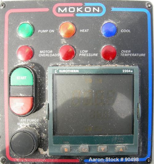 Used: Mokon hot oil temperature controller, model H54112CH. Maximum temperature 500 deg.f.. 3/60/460 volt, 12 kw, 15.1 heater amp. Mounted on casters. Built 2005