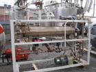 Used Chromalox electric oil heater, 30 kw capcity, electrically heated bayonet heater, 480 volt, 3 phase, skid mounted with Kontro centrifugal circulation pump, 316 stainless steel construction, 5 hp...