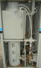 Used Cincinnati Milacron Hot Oil Temperature Control Unit,model CD0TC-100, 12 kw, 2 zones. Temperature range 100-500 deg F. 3/60/460 volt, 40 amp. Mounted on casters.