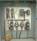 Used Cincinnati Milacron Hot Oil Temperature Control Unit,model CD0TC-100, 12 kw, 2 zones. Temperature range 100-500 deg F. 3/60/460 volt, 40 amp. Mounted on casters.