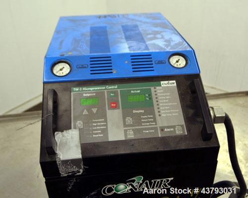 Used Conair Thermolator Water Temperature Controller, Model TW-2. 24 Kw heater, operating temperature range 35 to 250 degrees F. 3/60/460 Volt, 32 amps. Includes a TW-2 Microprocessor controller. Mou...