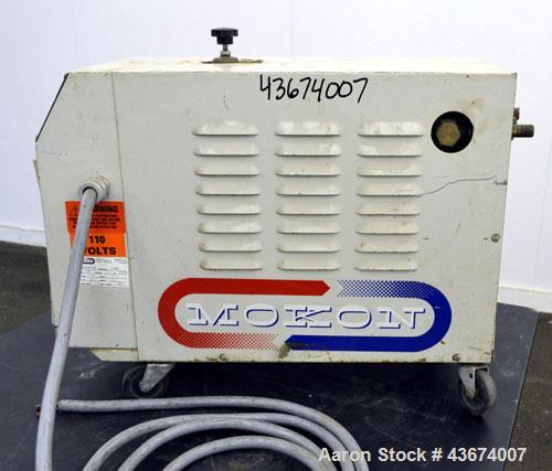 Used Mocon Leak-Master Negative Pressure System, Model NP1000-02. Designed to stop leaks in molds and processes without stopping production. 1/2hp pump (housing cracked), flow rate 9 gallons per minu...