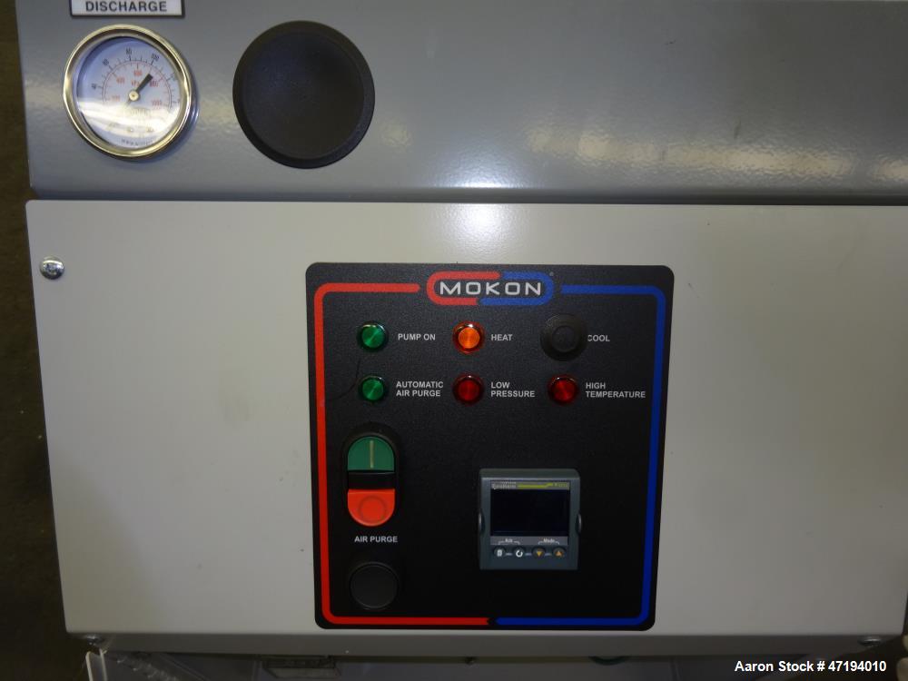 Unused- Mokon Minitherm Circulating Water Temperature Control System, Model MT4002AG. 2KW, 3/60/460 volts. Maximum temperature 250 degrees F. Includes a control panel with a Eurotherm controller. Ser...