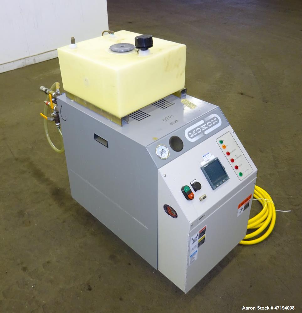 Used Mokon Minitherm Circulating Water Temperature Control System, Model MT430234. 2KW, 3/60/460 volts. Maximum temperature 200 degrees F. Includes a control panel with a Eurotherm controller. Serial...