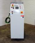 Used Mokon Duratherm Circulating Water Temperature Control System, Model DT4336HT. 36 KW, 3/60/460 volts. Maximum temperature 250 degrees F. Includes a control panel with a Eurotherm 2204E controller...