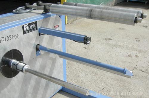 Used:Chase Machine and Engineering unwind unit. Single station. Approximately 30" wide capacity.Driven by a 1/2hp,180 volt, 1725 rpm DC motor with reducer, and DC motor controller.