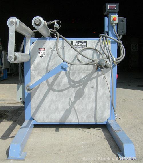 Used:Chase Machine and Engineering rewind unit. Single station. Approximately 30" wide capacity. Driven by a 3/4hp,180 volt, 1725 rpm DC motor with reducer,ratio 60 to 1, and DC motor controller.