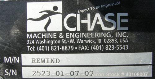 Used:Chase Machine and Engineering rewind unit. Single station. Approximately 30" wide capacity. Driven by a 3/4hp,180 volt, 1725 rpm DC motor with reducer,ratio 60 to 1, and DC motor controller.
