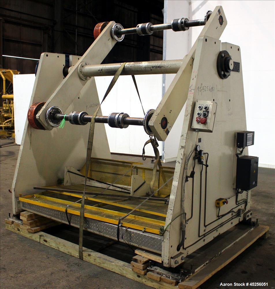 Used Dri-Tec Single Turret Dual Station Winder. Approximate 52" wide x 48" diameter roll capacity. Driven by a 5 hp, 3/208-230/460 volt, 1725 rpm gear motor, 1800 to 1 ratio.  Serial# 2413.