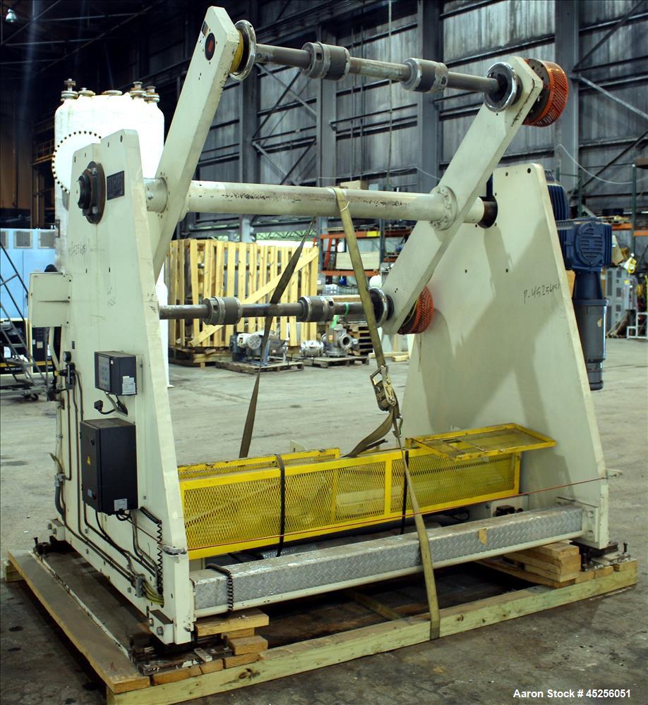 Used Dri-Tec Single Turret Dual Station Winder. Approximate 52" wide x 48" diameter roll capacity. Driven by a 5 hp, 3/208-230/460 volt, 1725 rpm gear motor, 1800 to 1 ratio.  Serial# 2413.