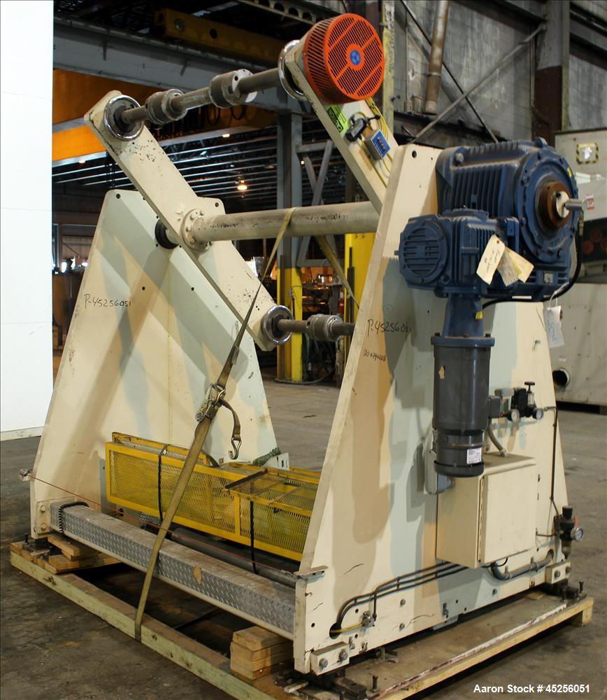 Used Dri-Tec Single Turret Dual Station Winder. Approximate 52" wide x 48" diameter roll capacity. Driven by a 5 hp, 3/208-230/460 volt, 1725 rpm gear motor, 1800 to 1 ratio.  Serial# 2413.