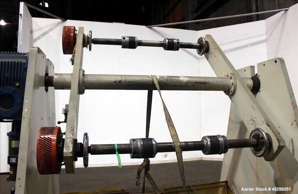 Used Dri-Tec Single Turret Dual Station Winder. Approximate 52" wide x 48" diameter roll capacity. Driven by a 5 hp, 3/208-230/460 volt, 1725 rpm gear motor, 1800 to 1 ratio.  Serial# 2413.