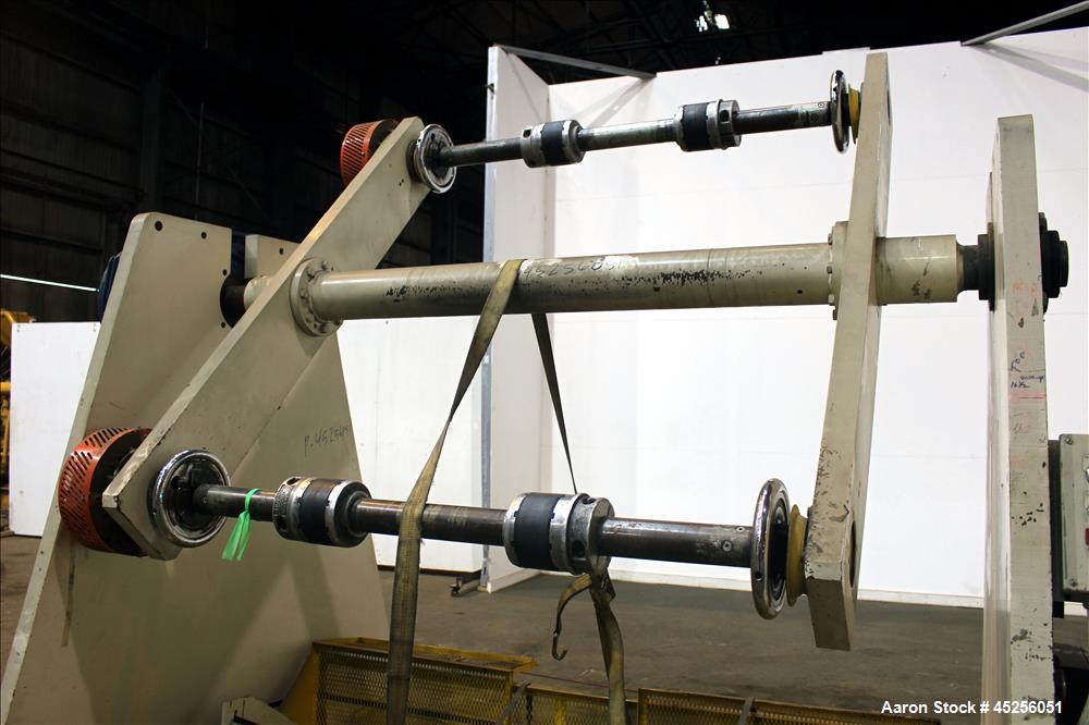 Used Dri-Tec Single Turret Dual Station Winder. Approximate 52" wide x 48" diameter roll capacity. Driven by a 5 hp, 3/208-230/460 volt, 1725 rpm gear motor, 1800 to 1 ratio.  Serial# 2413.