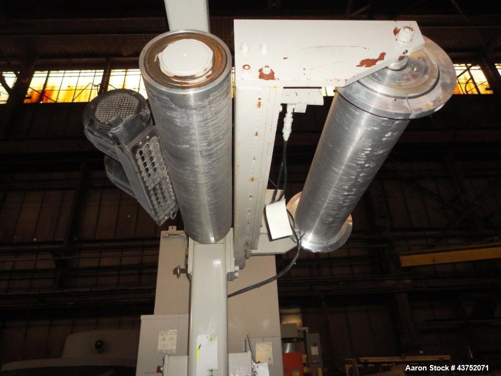 Used Cincinnati Milacron 30" Wide Unwind Stand. (2) Shaft with cantilever design. Able to handle up to 60" diameter rolls, set up for approximately 12" I.D. cores. Serial #2470A01/93-4. Last used wit...