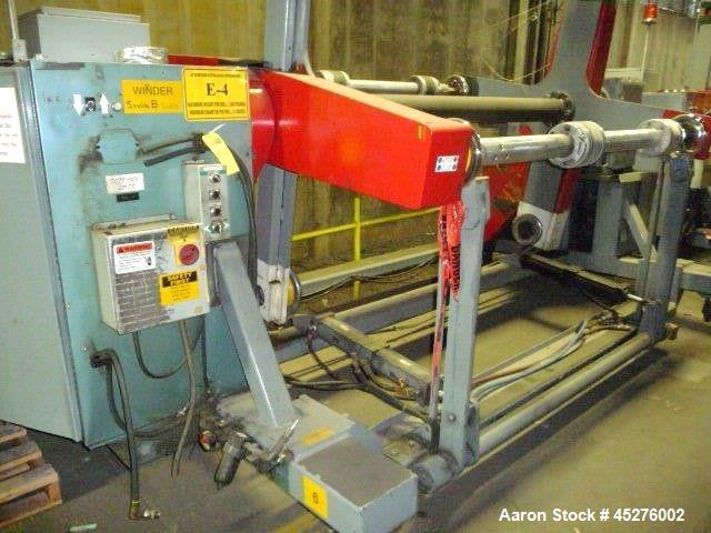 Used Crown 76" Wide Turret Winder. Up to 60" OD roll size, 2000# capacity, 4 position, single turret with motor drive.