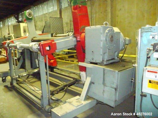 Used Crown 76" Wide Turret Winder. Up to 60" OD roll size, 2000# capacity, 4 position, single turret with motor drive.