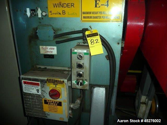 Used Crown 76" Wide Turret Winder. Up to 60" OD roll size, 2000# capacity, 4 position, single turret with motor drive.