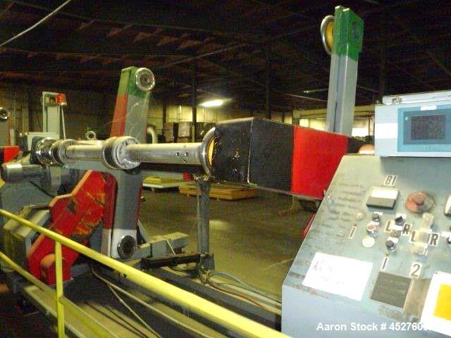 Used Crown 76" Wide Turret Winder. Up to 60" OD roll size, 2000# capacity, 4 position, single turret with motor drive.