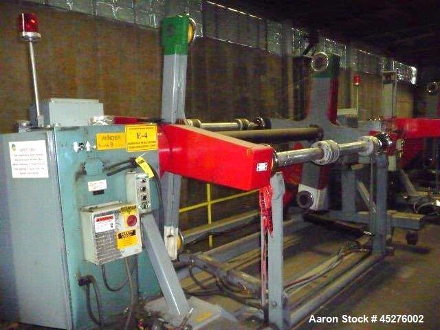 Used Crown 76" Wide Turret Winder. Up to 60" OD roll size, 2000# capacity, 4 position, single turret with motor drive.
