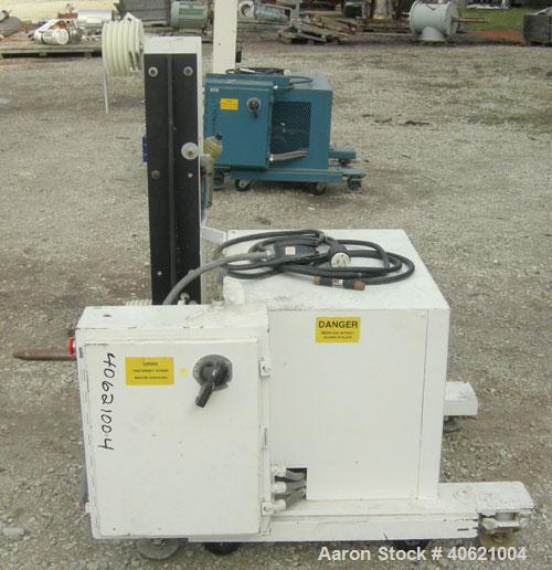 Used Davis Electric 18" Payoff, model MPO-18. Includes dancer and foot pedal jog. 17" shaft length. Driven by an approximate 1/4 hp motor.