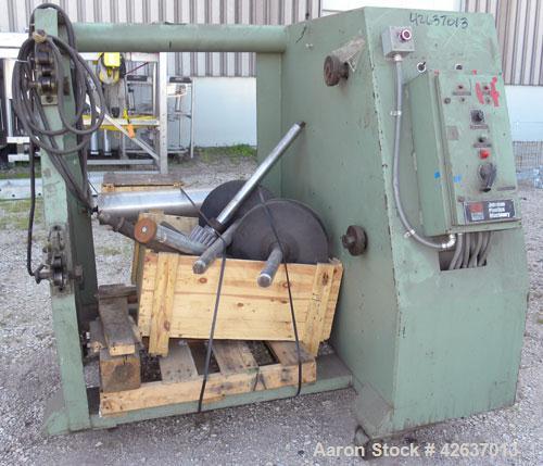 Used Johnson Plastics Machinery Dual Turret Winder, Approximately 36" wide. (1) Adjustable guide roll. Each roll driven by an approximate 2hp motor. Includes control panel. Mounted on casters.