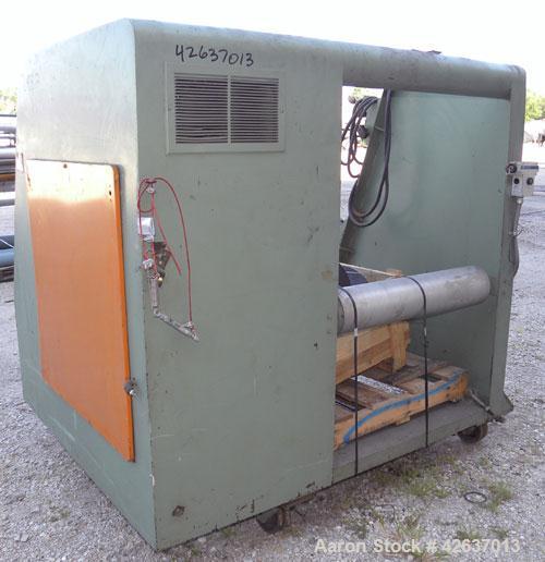 Used Johnson Plastics Machinery Dual Turret Winder, Approximately 36" wide. (1) Adjustable guide roll. Each roll driven by an approximate 2hp motor. Includes control panel. Mounted on casters.
