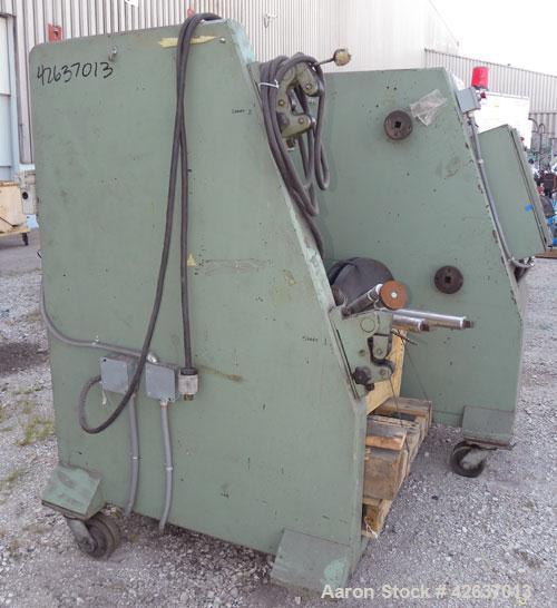 Used Johnson Plastics Machinery Dual Turret Winder, Approximately 36" wide. (1) Adjustable guide roll. Each roll driven by an approximate 2hp motor. Includes control panel. Mounted on casters.
