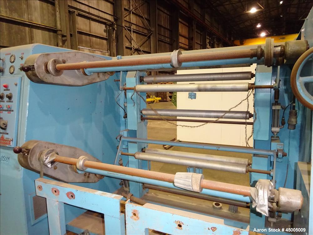 Used Johnson Dual Turret Winder, 48" Wide. Approximate 18" diameter roll capacity.
