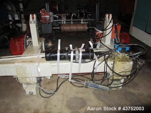 Used 48" Unwind Stand. Shaftless design, rated at 60" OD. With dual Montalvo brakes and a 2 hp hydraulic package for lateral adjustment. Currently set up for 8" chucks.