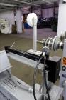 Used Progressive Machine Take-Up Spooling Machine, Model 609-RH. Maximum unwinding speed of 600 feet per minute. Maximum package weight 80 lbs., maximum width 20