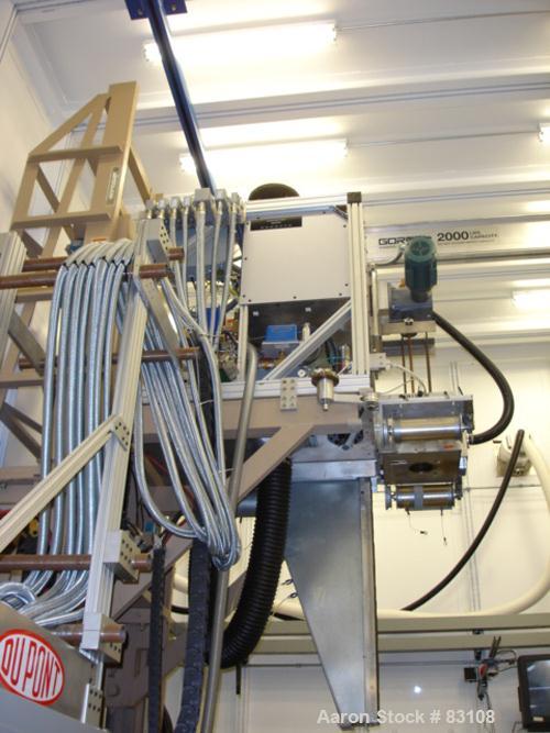 USED: Nylon/wire spinning line consisting of (1) 1" single screw extruder, 30:1 L/D ratio. Electrically heated, air cooled 7 zone barrel. Water cooled feed throat with hopper. Driven by a 5 hp, 3/60/...