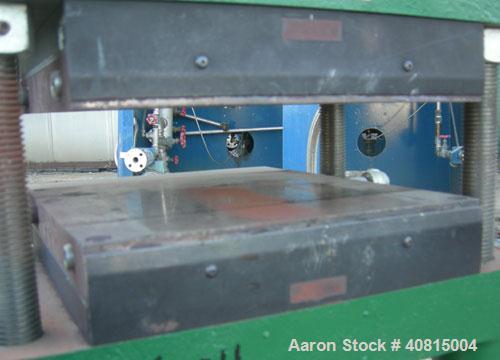 Used Carver Manual Hydraulic Press, 12 Ton, Model 2696.  Hand operated for 0-12 tons (24,000 pounds).  (2) 12" x 12" electrically heated, water cooled platens.  Ram stroke 5.1", daylight opening 1" t...